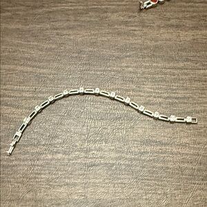 Lia Sophia Silver Chain Bracelet with cubic zirconia princess cut stones.